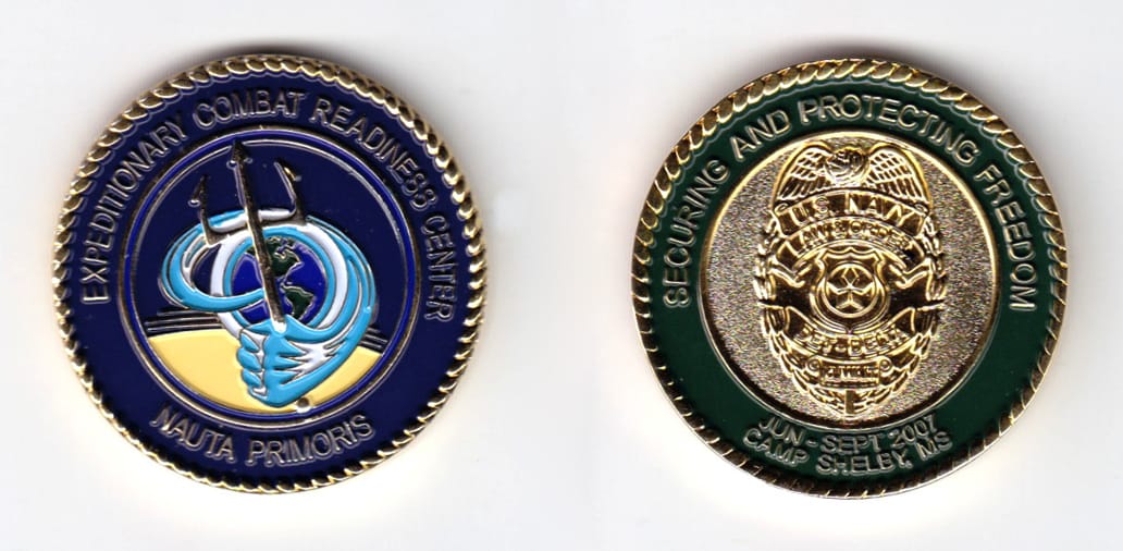 Round shaped, gold colored coin, 1-9/16 inches in diameter.