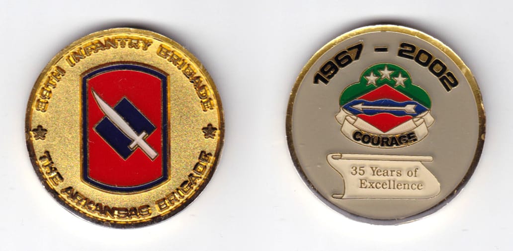 Round shaped, gold colored coin, 1-9/16 inches in diameter.