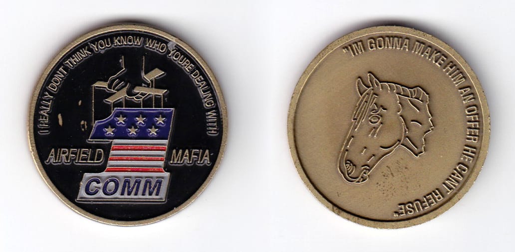 Round shaped, brass colored coin, 1-9/16 inches in diameter.