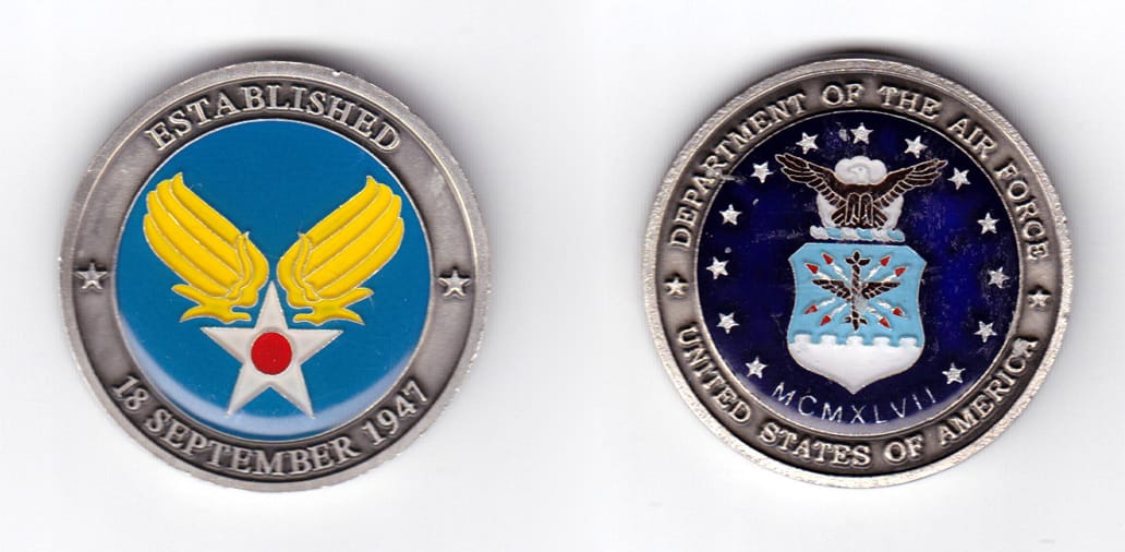 Round shaped, pewter colored coin, 1-9/16 inches in diameter.