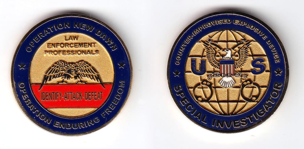 Round shaped, gold colored coin, 1-1/2 inches in diameter.