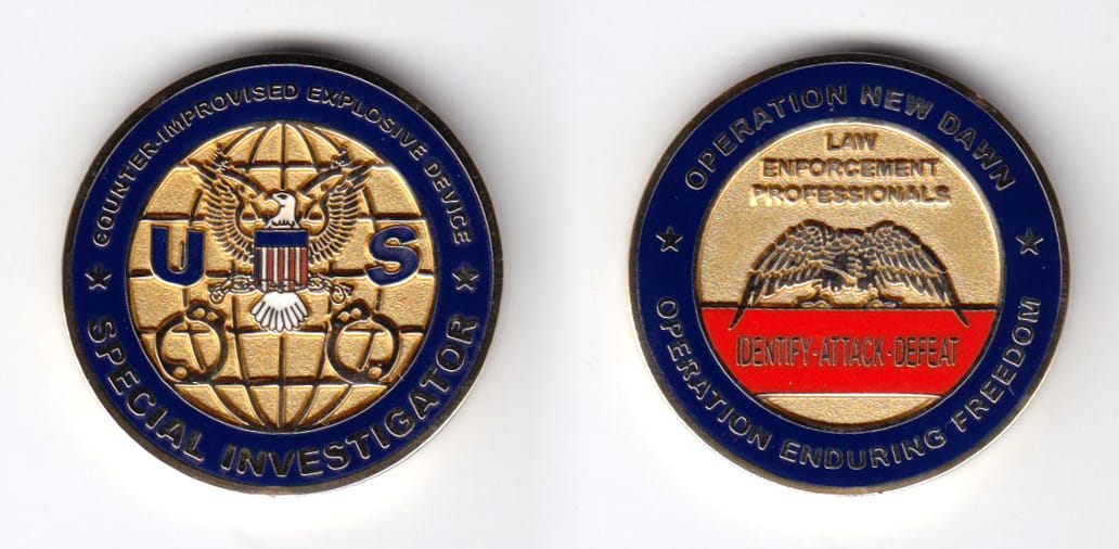 Round shaped, gold colored coin, 1-1/2 inches in diameter.