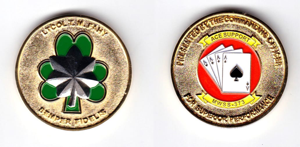 Round shaped, gold colored coin, 1-1/2 inches in diameter.