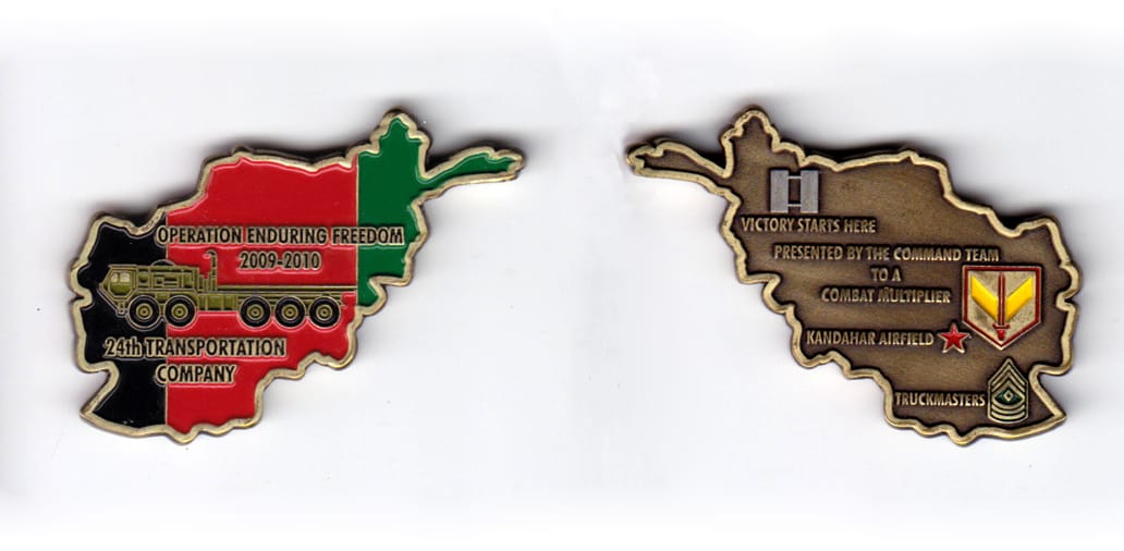 Afghanistan shaped, brass colored coin, 2 inches wide x 1-1/2 inches high.