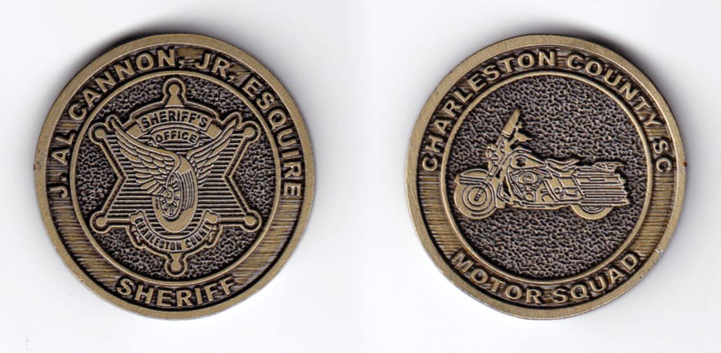 Round shaped, antique brass colored coin, 1-1/2 inches in diameter.