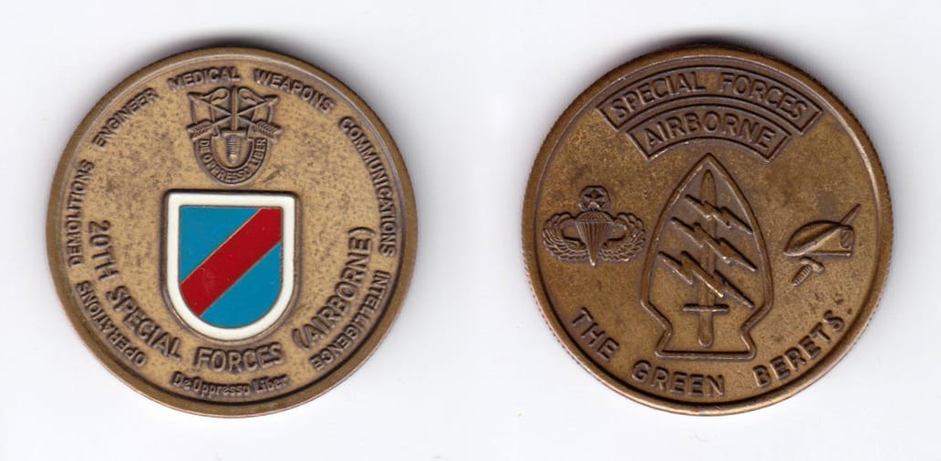 Round shaped, antique brass colored coin, 1-1/2 inches in diameter.