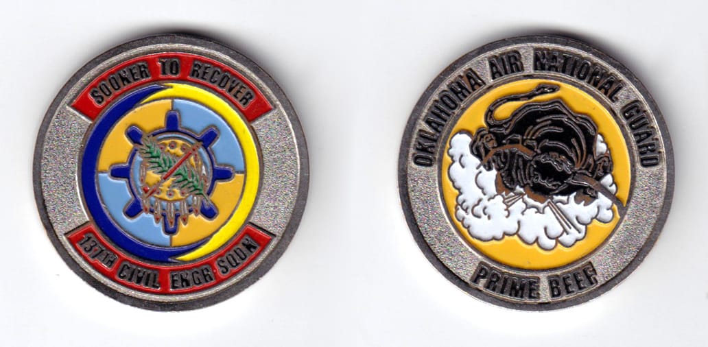 Round shaped, silver colored coin, 1-1/2 inches in diameter.