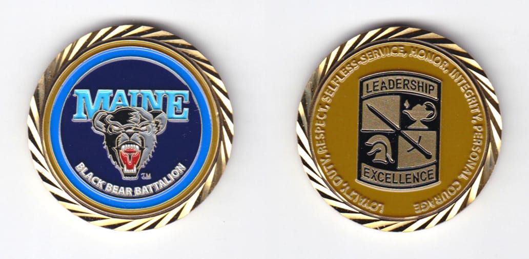 Round shaped, gold colored coin, 1-1/2 inches in diameter.