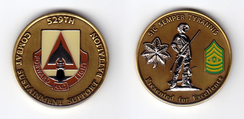 Round shaped, brass colored coin, 1-9/16 inches in diameter.