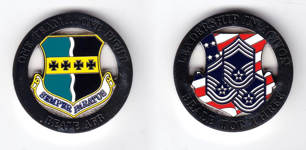 Round shaped, silver colored coin, 1-5/8 inches in diameter.