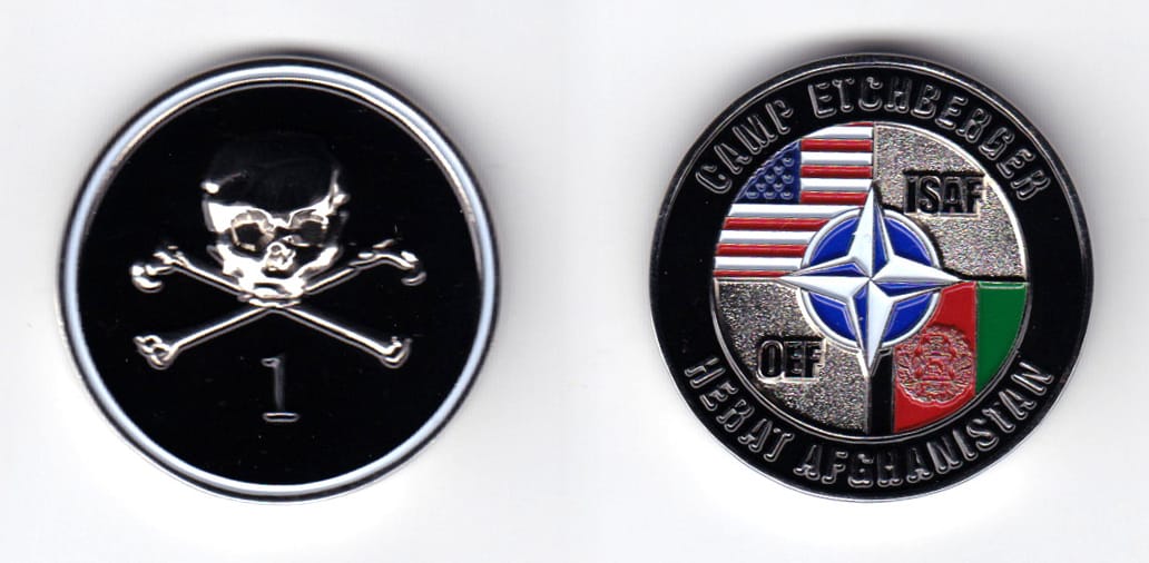 Round shaped, silver colored coin, 1-1/2 inches in diameter.