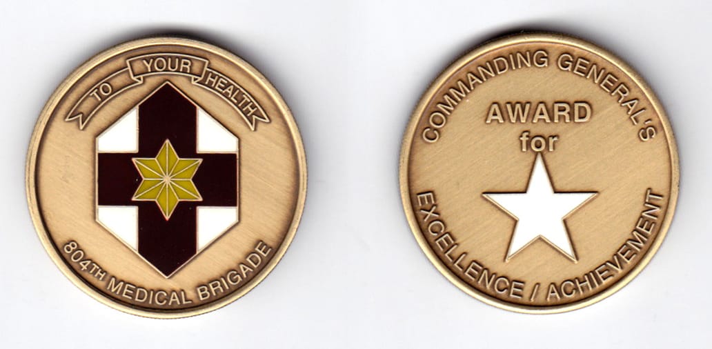 Round shaped, brass colored coin, 1-5/8 inches in diameter.