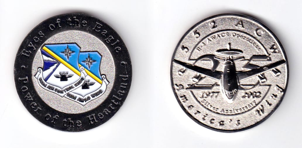 Round shaped, silver colored coin, 1-3/4 inches in diameter.