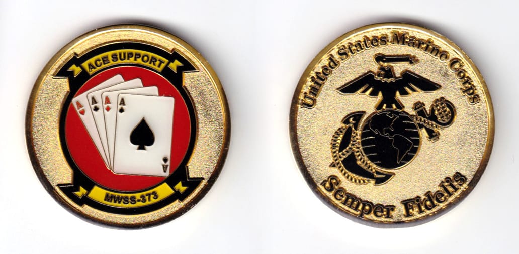 Round shaped, gold colored coin, 1-3/4 inches in diameter.