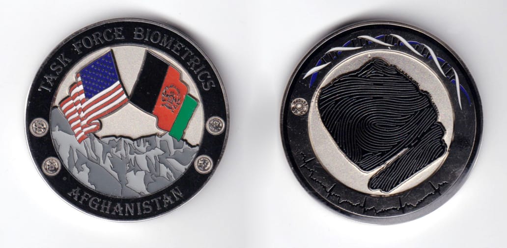 Round shaped, silver colored coin, 1-3/4 inches in diameter.