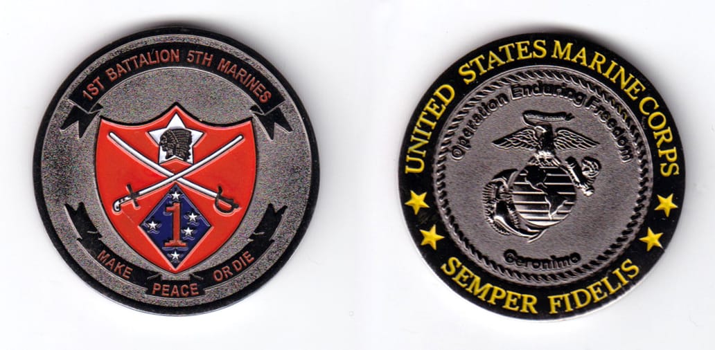 Round shaped, gun metal black colored coin, 1-3/4 inches in diameter.