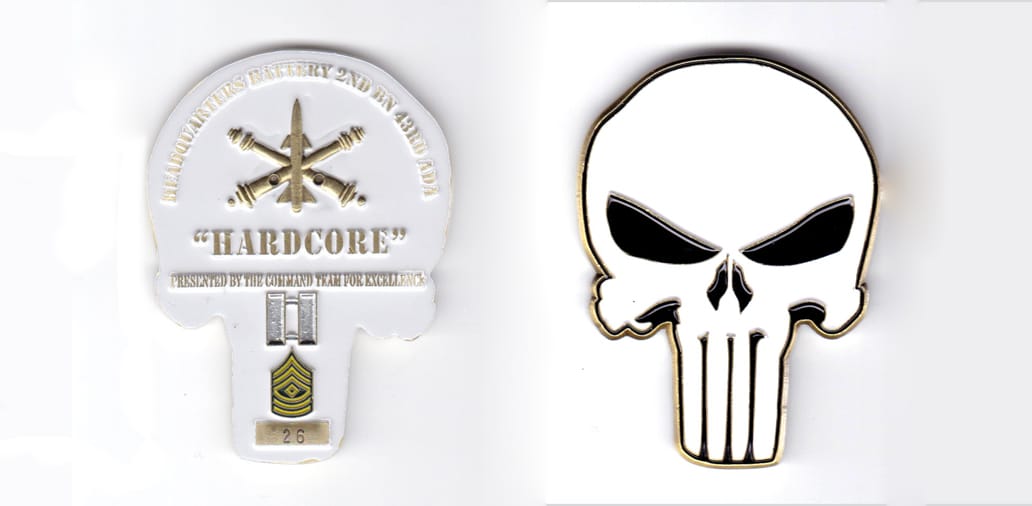 Skull shaped, brass colored coin, 2 inches wide x 2-5/8 inches high.