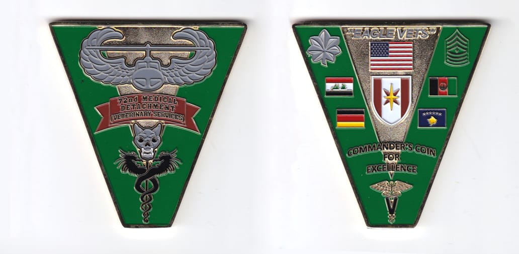 Triangular shaped, gold colored coin, 2-7/8 inches wide x 3 inches high.