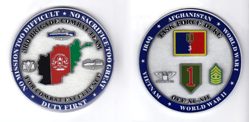 Round shaped, pewter colored coin, 3 inches in diameter.