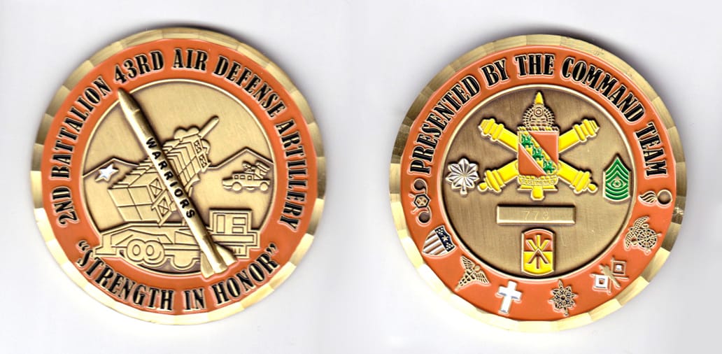 Round shaped, brass colored coin, 2-1/4 inches in diameter.