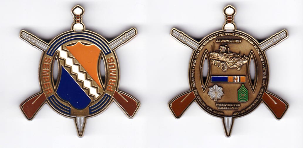 Oval shaped, with crossed rifes and sword extended, antique brass colored coin, 2 inches wide x 2-1/4 inches high.