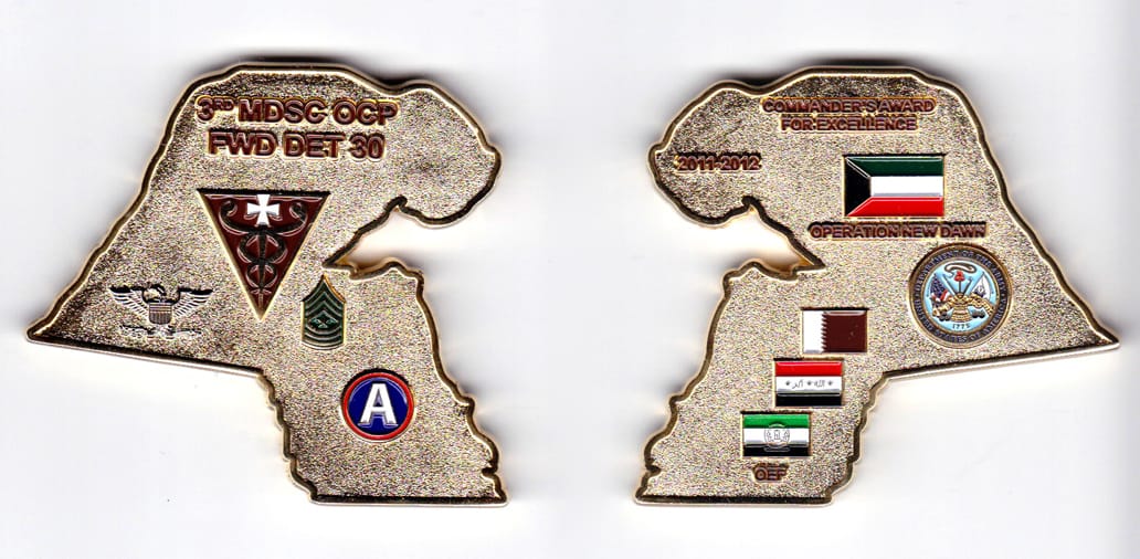 Map shaped, gold colored coin, 2-1/2 inches wide x 2-1/4 inches high.