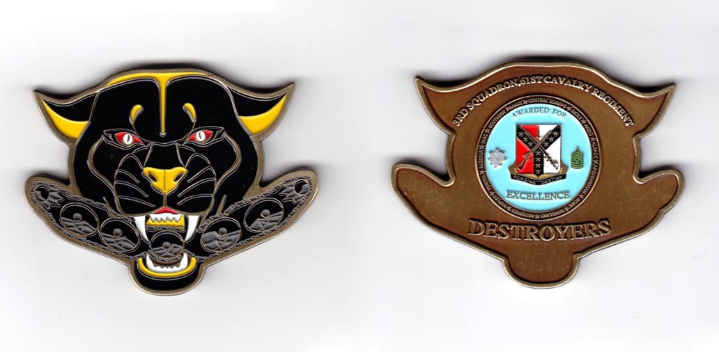 Panther head shaped, antique brass colored coin, 2-3/4 inches wide x 2-1/8 inches high.