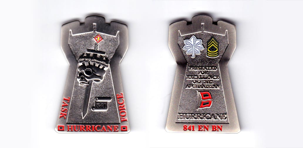 Castle tower shaped, pewter colored coin, 1-1/2 inches wide x 2-1/2 inches high.