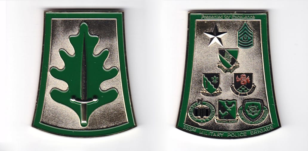 Gold colored coin, 2-1/2 inches wide x 3 inches high.