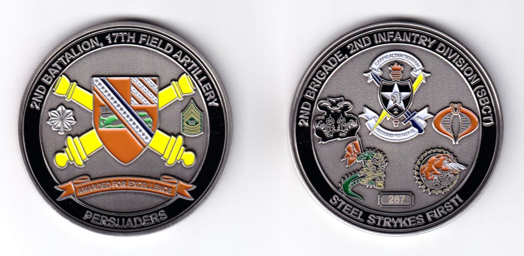 Round shaped, gold colored coin, 2-3/4 inches in diameter.