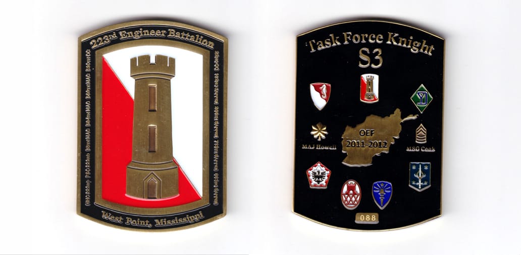 Retangular shaped, with bowed top and bottom edges, brass colored coin, 2-1/6 inches wide x 3 inches high.