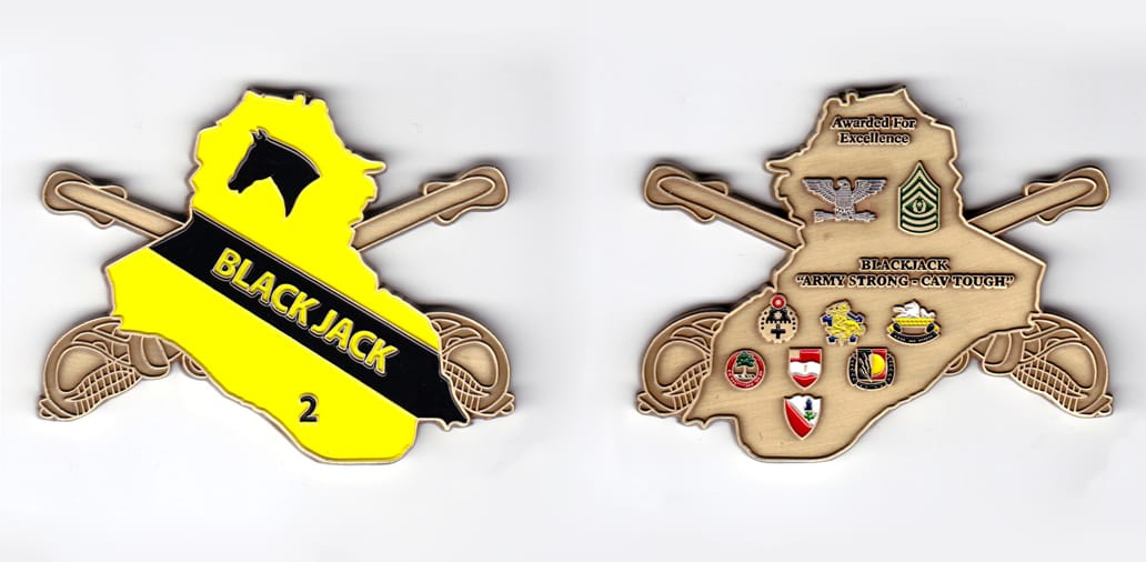 Iraq shaped with crossed swords extending, brass colored coin, 3 inches wide x 2-1/4 inches high.