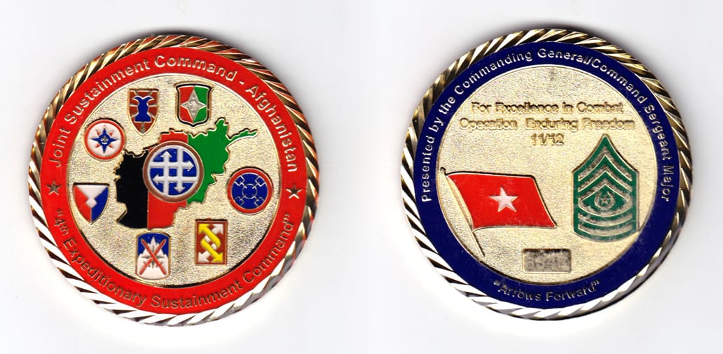 Round shaped, gold colored coin, 2-1/2 inches in diameter.