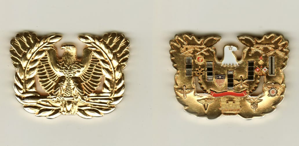 Warrant Officer Insignia shaped, gold colored coin, 1 1/4 inches high x 2  inches wide.