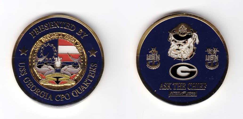 Round shaped, gold colored coin, 1-3/4 inches in diameter.