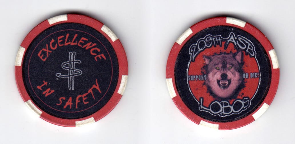 Round shaped, red colored poker chip, 1-1/2 inches in diameter.