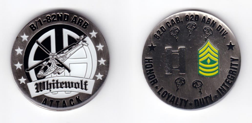 Round shaped, pewter colored coin, 2 inches in diameter.