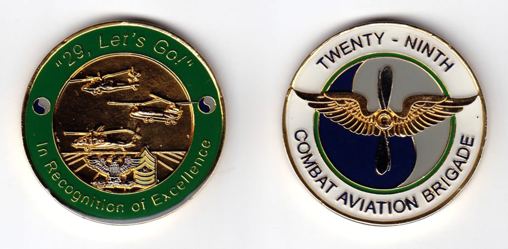 Round shaped, brass colored coin, 2 inches in diameter.