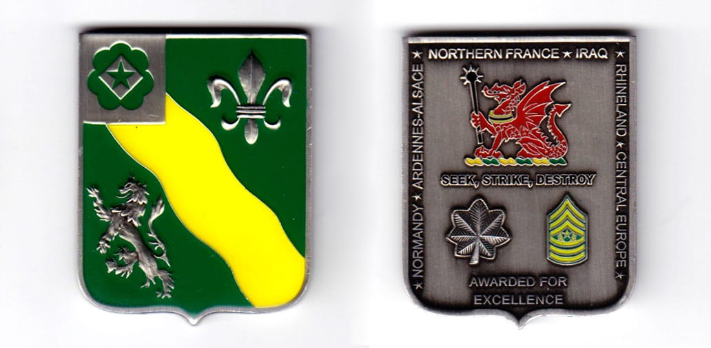 Shield shaped, pewter colored coin, 2 inches high x 1-1/2 inches wide.