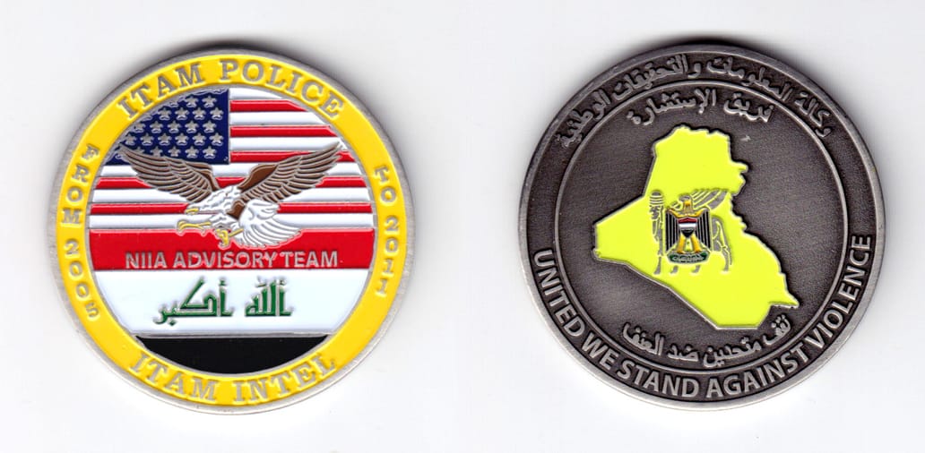 Round shaped, silver colored coin, 2 inches in diameter.