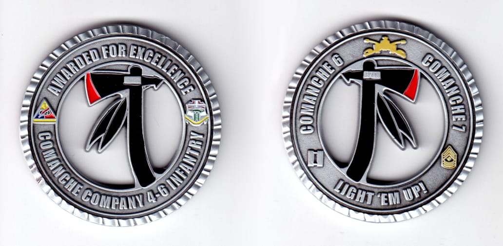 Round shaped, pewter colored coin, 2 inches in diameter.