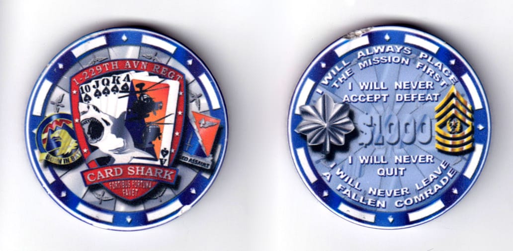 Round shaped, blue colored poker chip, 2 inches in diameter.