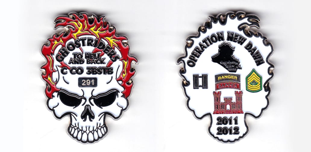 Skull shaped, with flames extending from top, silver colored coin, 2 inches high x 1-1/2  inches wide.