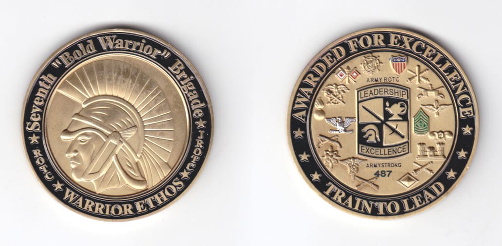 Round shaped, brass colored coin, 2 inches in diameter.