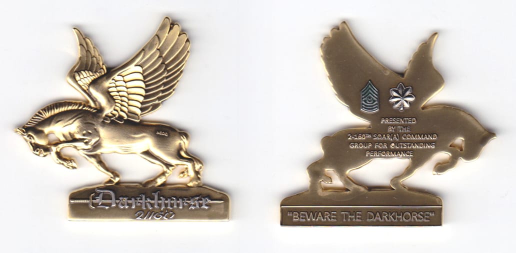 Pegasus on a stand shaped, brass colored coin, 2 inches high x 2-1/8  inches wide.