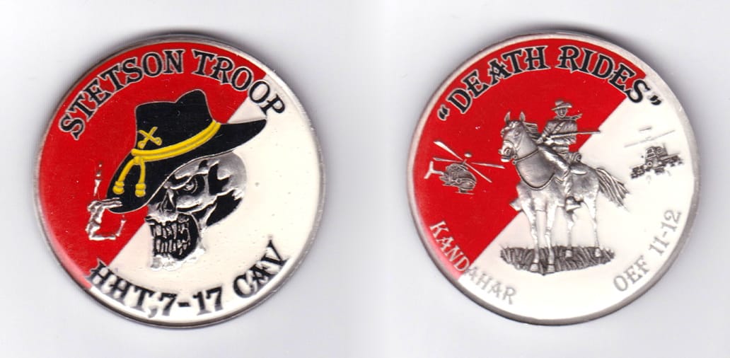 Round shaped, silver colored coin, 2 inches in diameter.