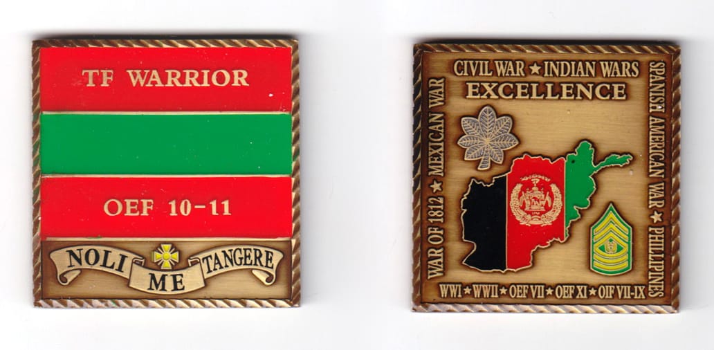 Square shaped, bronze colored coin, 2 inches high x 2  inches wide.