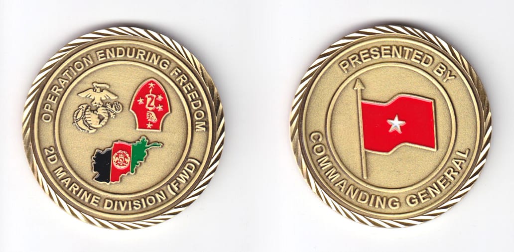 Round shaped, brass colored coin, 2 inches in diameter.