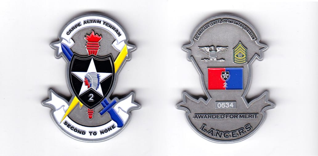 Shield shaped, with banner mounted above and beneath, pewter colored coin, 2 inches high x 1-9/16  inches wide.