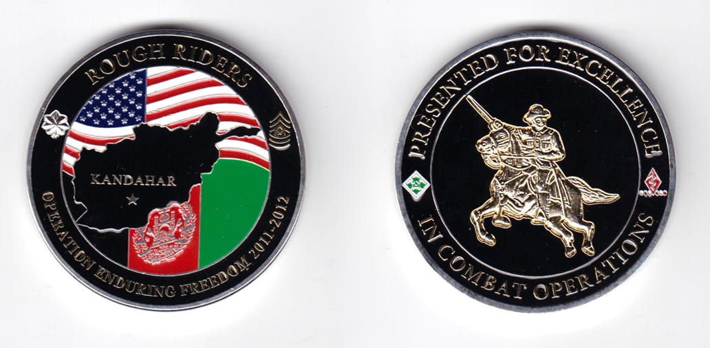 Round shaped, silver colored coin, 2 inches in diameter.